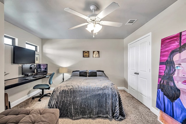 811 E 97th Ct, Odessa, TX 79765 - carpeted bedroom featuring a desk, baseboards, ceiling fan, and a closet