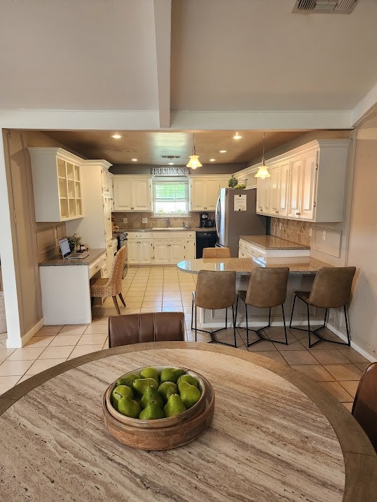dining space featuring recessed lighting, beamed ceiling, visible vents, and light tile patterned flooring