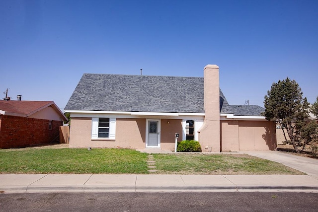 8731 Dublin Ave, Odessa, TX 79765 - view of front facade featuring a chimney, a garage, brick siding, a front lawn, and concrete driveway