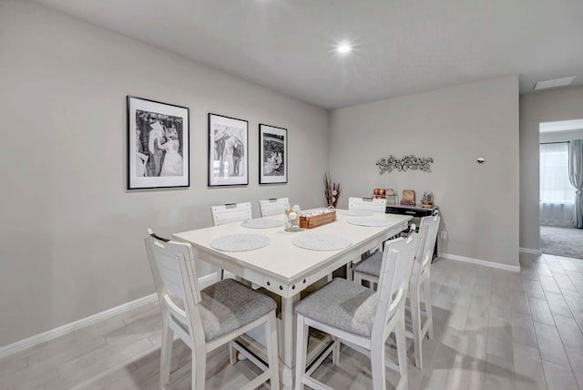8409 E County Rd 115, Midland, TX 79706 - dining space with baseboards and light wood-style flooring