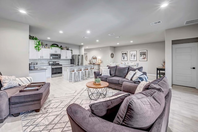 8409 E County Rd 115, Midland, TX 79706 - living area with recessed lighting and light wood-style floors