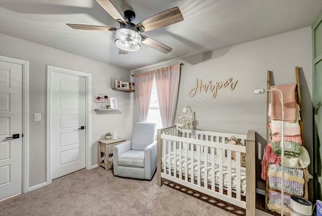 8409 E County Rd 115, Midland, TX 79706 - carpeted bedroom with a crib and a ceiling fan