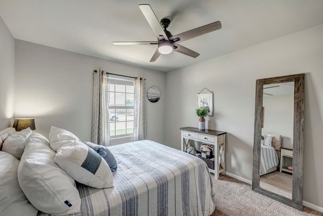 8409 E County Rd 115, Midland, TX 79706 - bedroom with light carpet, baseboards, and ceiling fan