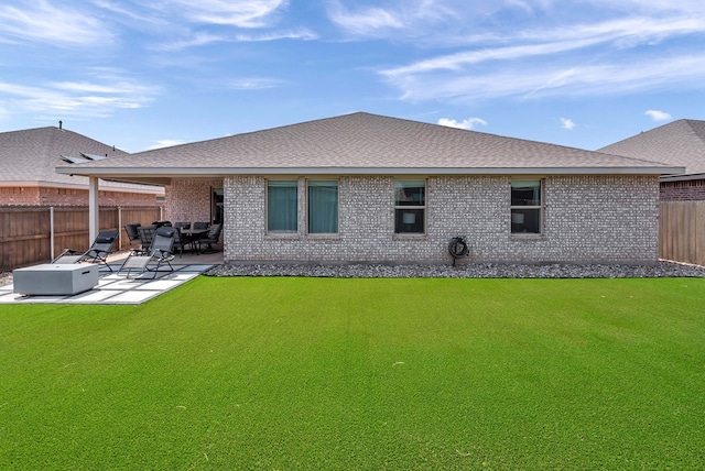 8409 E County Rd 115, Midland, TX 79706 - rear view of house featuring brick siding, a patio, and a shingled roof