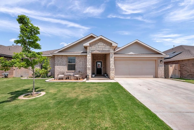 8409 E County Rd 115, Midland, TX 79706 - single story home featuring a garage, concrete driveway, brick siding, and stone siding