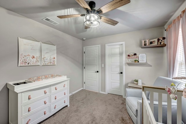 8409 E County Rd 115, Midland, TX 79706 - bedroom with light carpet, baseboards, and a ceiling fan
