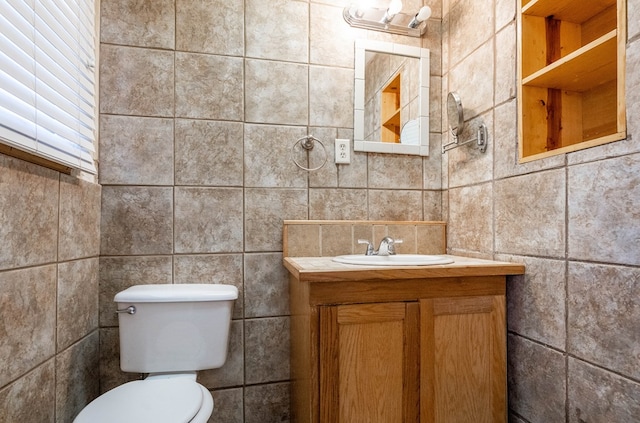 309 SW 10th St, Andrews, TX 79714 - bathroom with tile walls and vanity