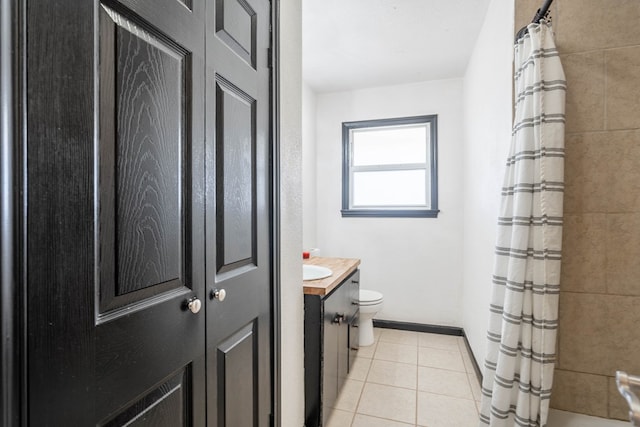 309 SW 10th St, Andrews, TX 79714 - bathroom featuring vanity, tile patterned floors, and shower / bathtub combination with curtain