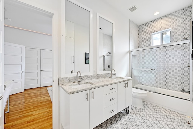 1007 E Texas St, Marfa, TX 79843 - full bath featuring toilet, combined bath / shower with glass door, and double vanity