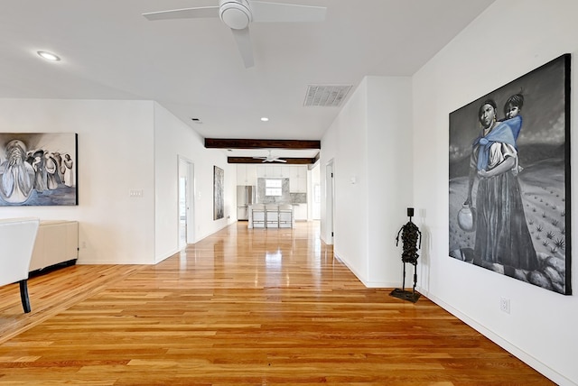 1007 E Texas St, Marfa, TX 79843 - hall featuring light wood-type flooring, baseboards, recessed lighting, and beam ceiling