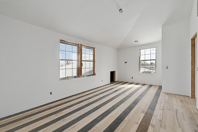 1007 E Texas St, Marfa, TX 79843 - unfurnished room featuring lofted ceiling and light wood-style flooring