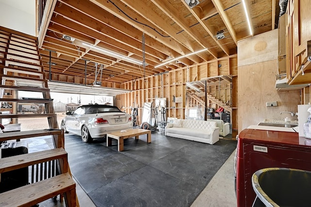 1007 E Texas St, Marfa, TX 79843 - garage featuring a garage door opener and a sink