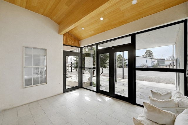 1007 E Texas St, Marfa, TX 79843 - doorway to outside with wooden ceiling, vaulted ceiling, healthy amount of natural light, french doors, and tile patterned flooring