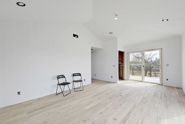 1007 E Texas St, Marfa, TX 79843 - empty room with light wood-style floors and high vaulted ceiling