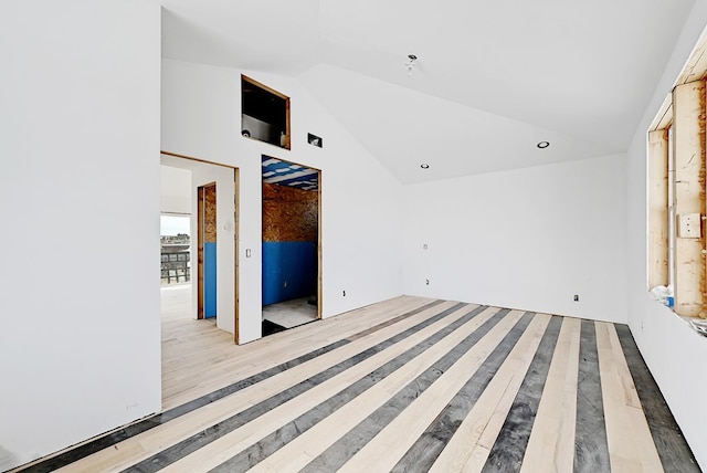 1007 E Texas St, Marfa, TX 79843 - unfurnished living room with wood finished floors and high vaulted ceiling