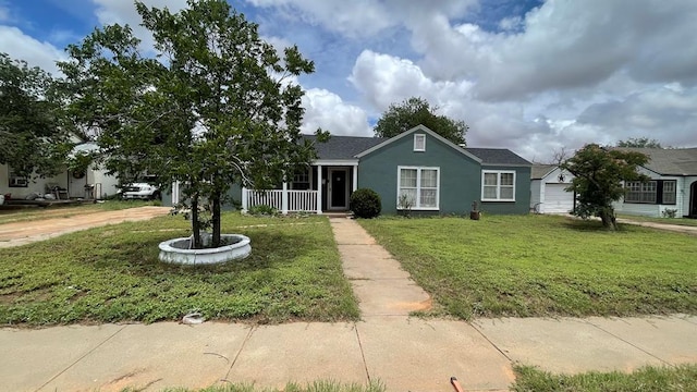 708 N 7th St, Lamesa, TX 79331 - ranch-style house with a front lawn, stucco siding, and covered porch