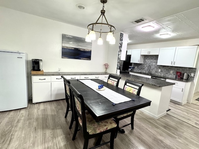 503 E Hendryx Ave, Alpine, TX 79830 - dining room with light wood-style floors