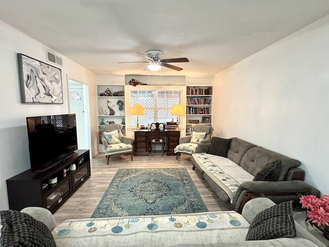 503 E Hendryx Ave, Alpine, TX 79830 - living area with light wood finished floors, a ceiling fan, and built in features