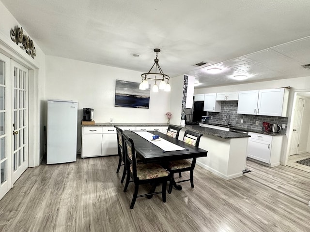 503 E Hendryx Ave, Alpine, TX 79830 - dining space with light wood-type flooring