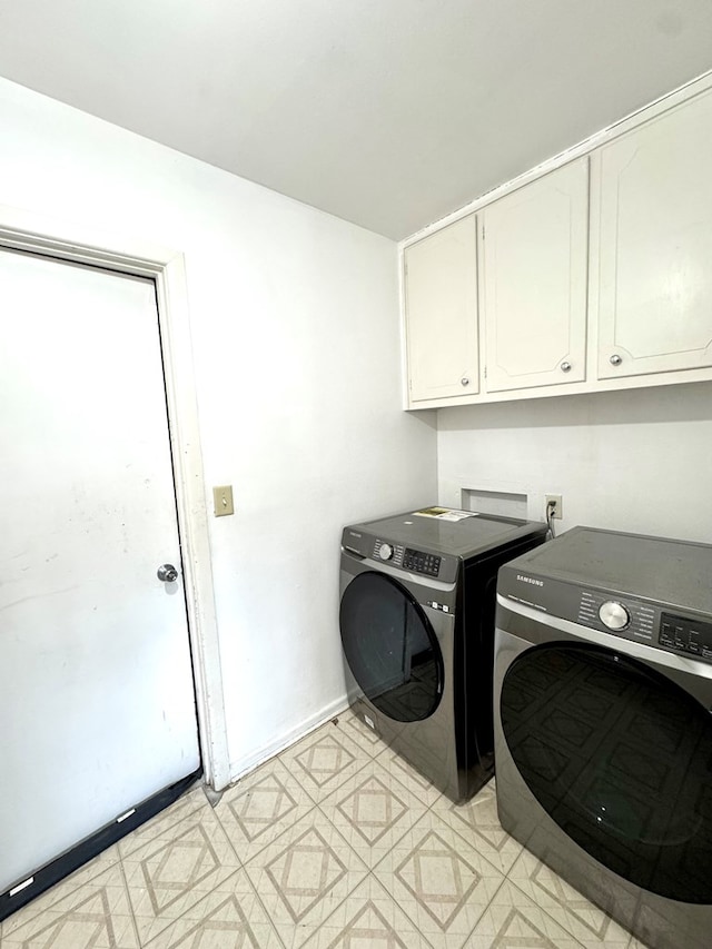 503 E Hendryx Ave, Alpine, TX 79830 - washroom featuring cabinet space, washing machine and dryer, baseboards, and light floors