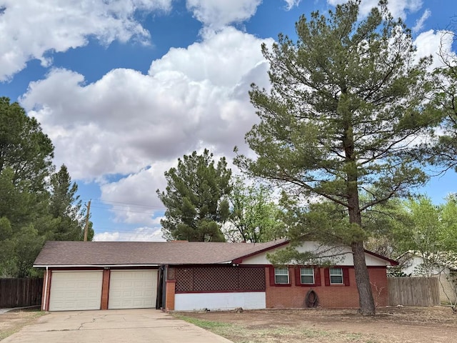 503 E Hendryx Ave, Alpine, TX 79830 - single story home featuring concrete driveway, an attached garage, and brick siding