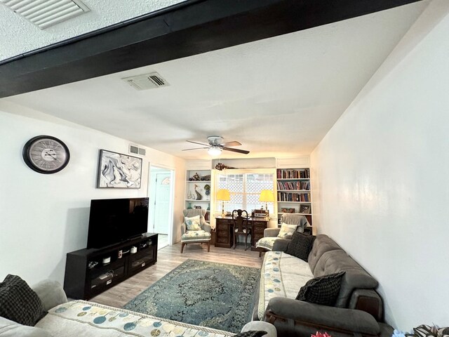 503 E Hendryx Ave, Alpine, TX 79830 - living room featuring wood finished floors, ceiling fan, and built in features