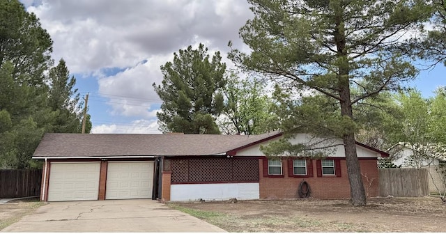 503 E Hendryx Ave, Alpine, TX 79830 - ranch-style house with an attached garage, concrete driveway, and brick siding