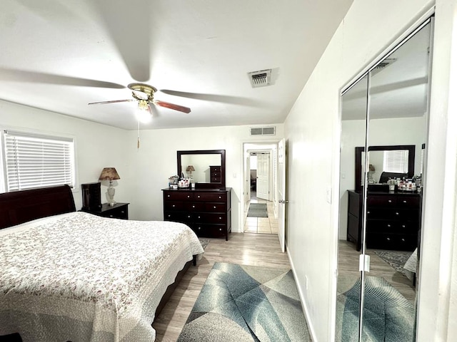 503 E Hendryx Ave, Alpine, TX 79830 - bedroom featuring wood finished floors, ceiling fan, a closet, and baseboards
