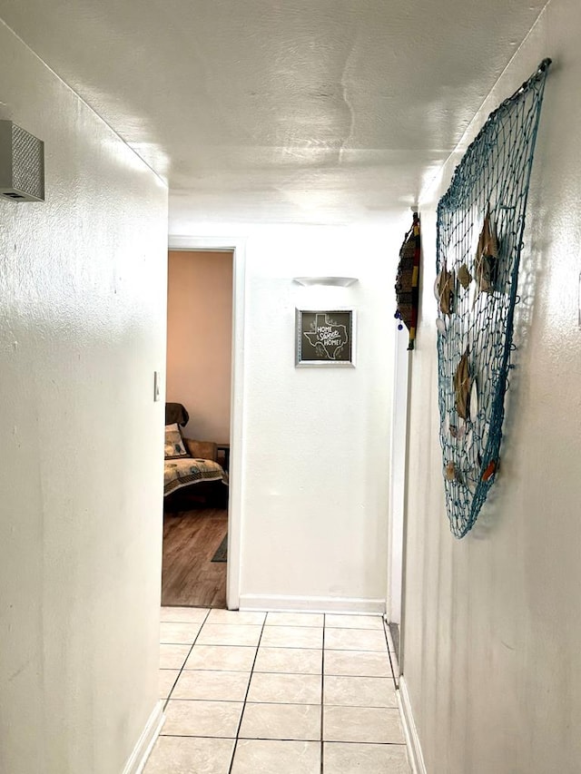 503 E Hendryx Ave, Alpine, TX 79830 - corridor with light tile patterned flooring and baseboards