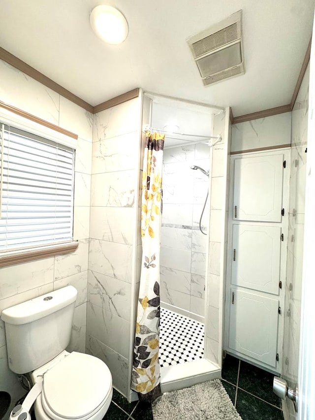 503 E Hendryx Ave, Alpine, TX 79830 - bathroom with a stall shower, toilet, tile patterned floors, and crown molding