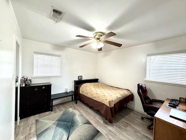 503 E Hendryx Ave, Alpine, TX 79830 - bedroom with light wood finished floors, an office area, and a ceiling fan