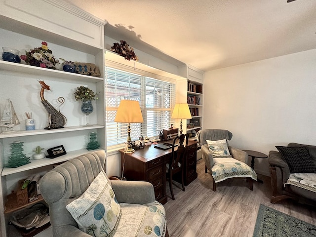 503 E Hendryx Ave, Alpine, TX 79830 - sitting room with wood finished floors, built in features, and an office area