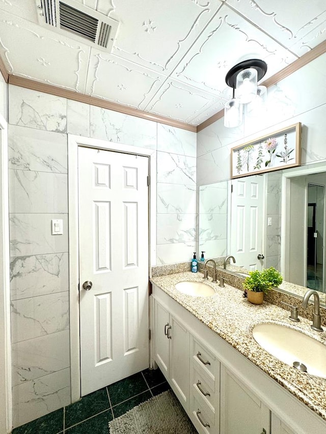 503 E Hendryx Ave, Alpine, TX 79830 - bathroom featuring tile patterned flooring, double vanity, and ornamental molding
