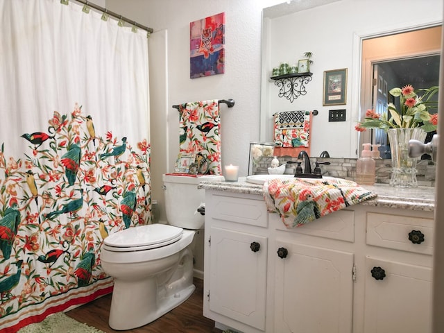 1847 Cody Pl, Odessa, TX 79762 - bathroom with vanity, wood finished floors, and a shower with curtain