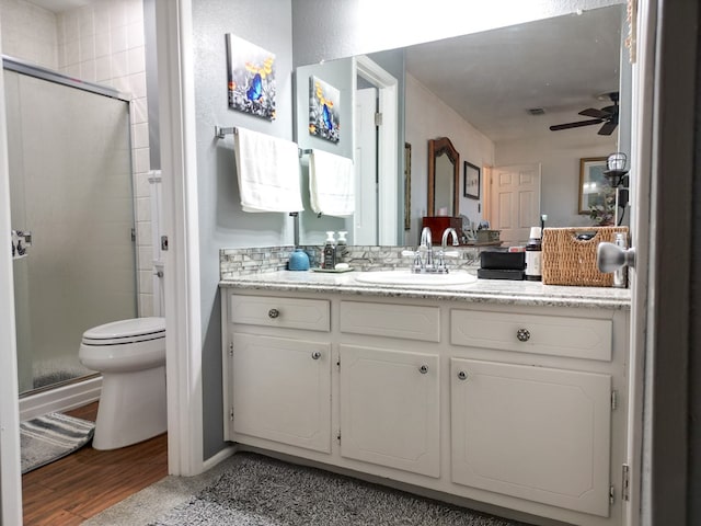 1847 Cody Pl, Odessa, TX 79762 - full bath featuring a shower stall, ceiling fan, vanity, and wood finished floors