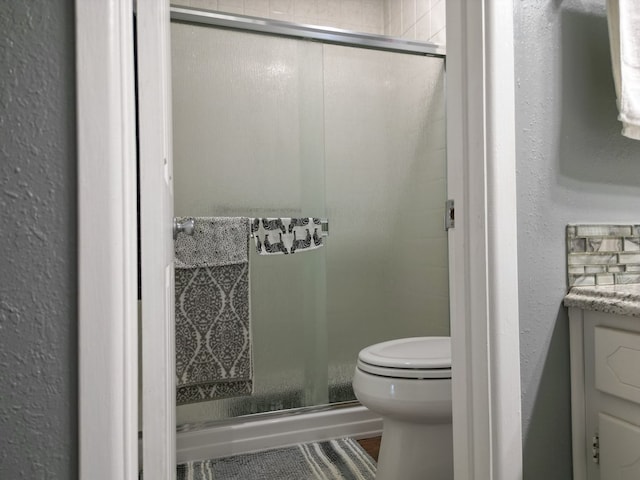 1847 Cody Pl, Odessa, TX 79762 - bathroom featuring a shower stall, vanity, and a textured wall