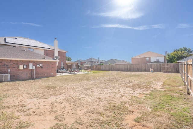 view of yard with a patio and central AC