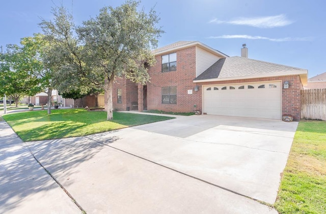 view of front facade with a garage and a front lawn