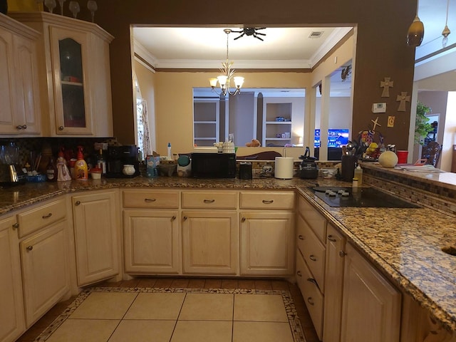 kitchen with glass insert cabinets, light tile patterned floors, a chandelier, and ornamental molding