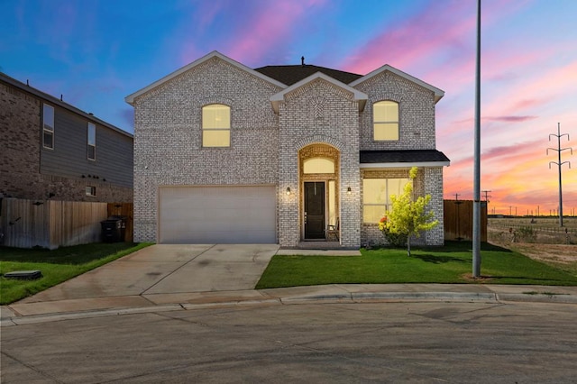 3102 Mearns Ct, Midland, TX 79705 - view of front facade with brick siding, an attached garage, and driveway