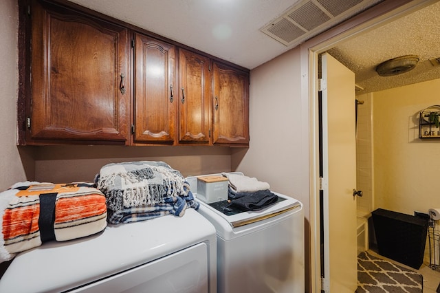 3946 Scott St, Odessa, TX 79762 - laundry room featuring washing machine and clothes dryer and cabinet space