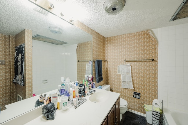 3946 Scott St, Odessa, TX 79762 - full bathroom featuring a textured ceiling, toilet, vanity, baseboards, and wallpapered walls