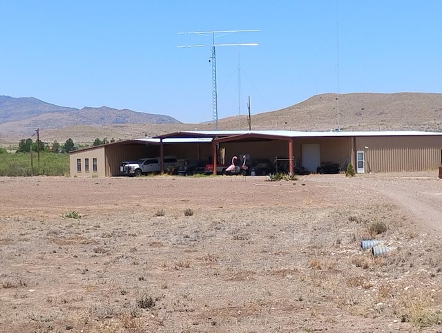 735 S Front St, Fort Davis, TX 79734 - back of property featuring a carport, a mountain view, and dirt driveway