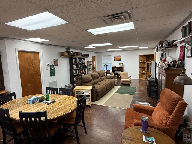 735 S Front St, Fort Davis, TX 79734 - dining room featuring finished concrete floors and a paneled ceiling