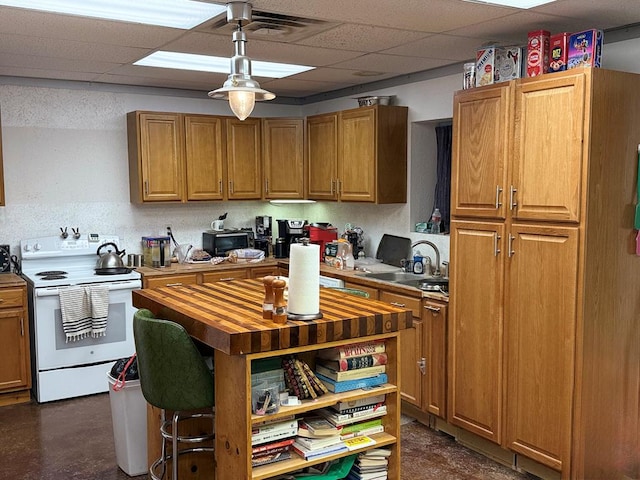 735 S Front St, Fort Davis, TX 79734 - kitchen featuring electric range, butcher block countertops, a drop ceiling, open shelves, and brown cabinetry