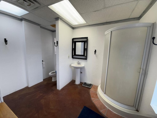 735 S Front St, Fort Davis, TX 79734 - full bath with a drop ceiling, toilet, a stall shower, unfinished concrete floors, and a sink