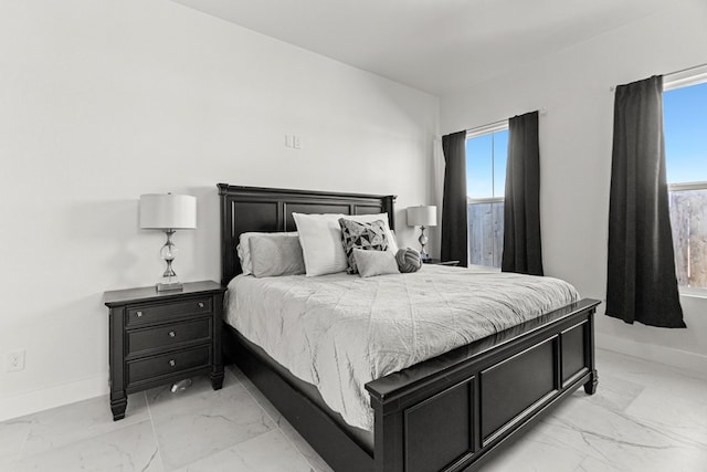 8652 Fiesta Ct, Odessa, TX 79765 - bedroom with light marble finish floors and multiple windows