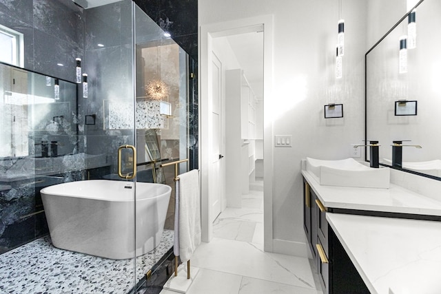 8652 Fiesta Ct, Odessa, TX 79765 - bathroom with marble finish floors, vanity, a soaking tub, and a stall shower