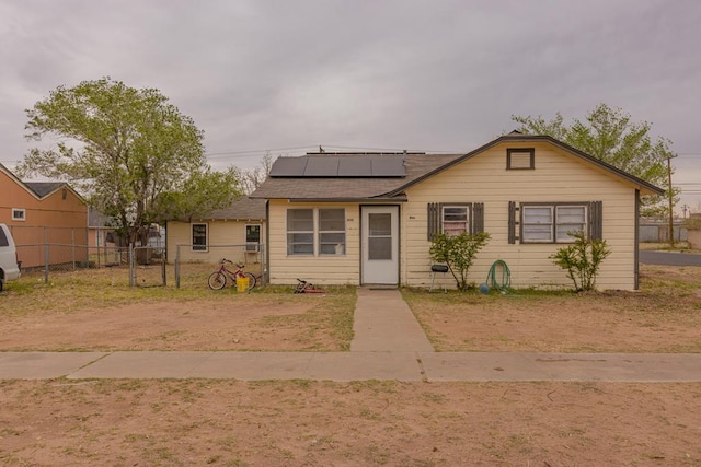 900 N Dotsy Ave, Odessa, TX 79763 - bungalow with roof mounted solar panels and roof with shingles