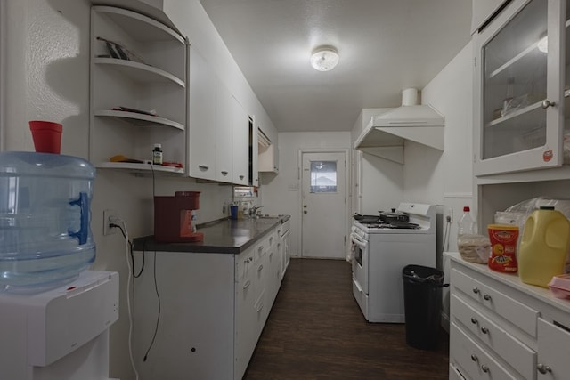 900 N Dotsy Ave, Odessa, TX 79763 - kitchen featuring white gas stove, dark wood-style flooring, white cabinets, custom range hood, and glass insert cabinets